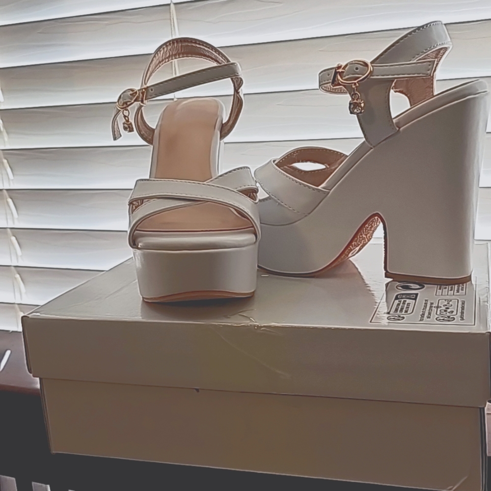 Size Euro 37, U.S.A size 6 1/2! White platform sandals!with ankle diamond charm!